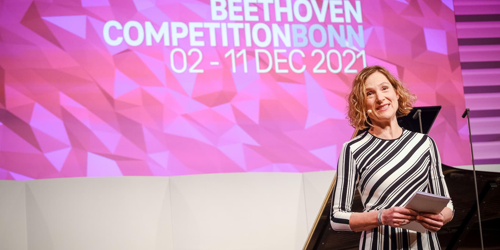 Woman giving a speech at the Beethoven Competition Bonn, December 2-11, 2021.