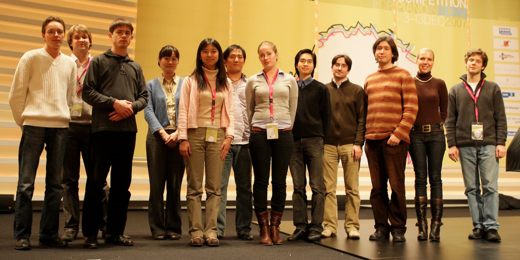 Group of twelve people standing on a stage at a competition in Bonn in December 2007.