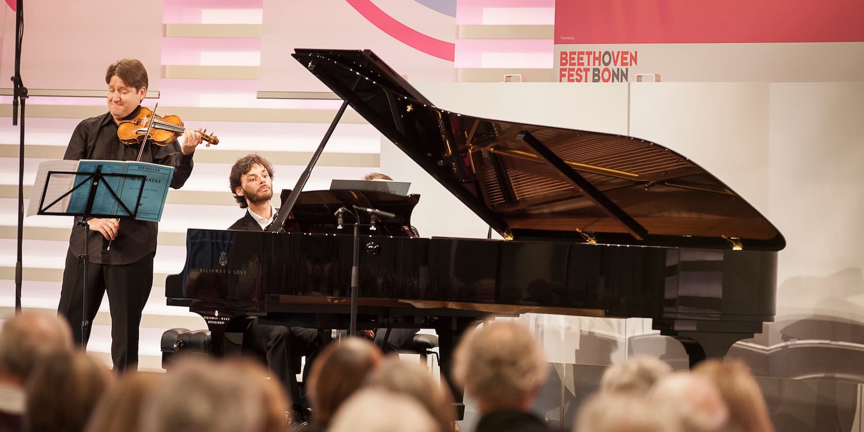 A violinist and a pianist performing at the Beethovenfest Bonn.