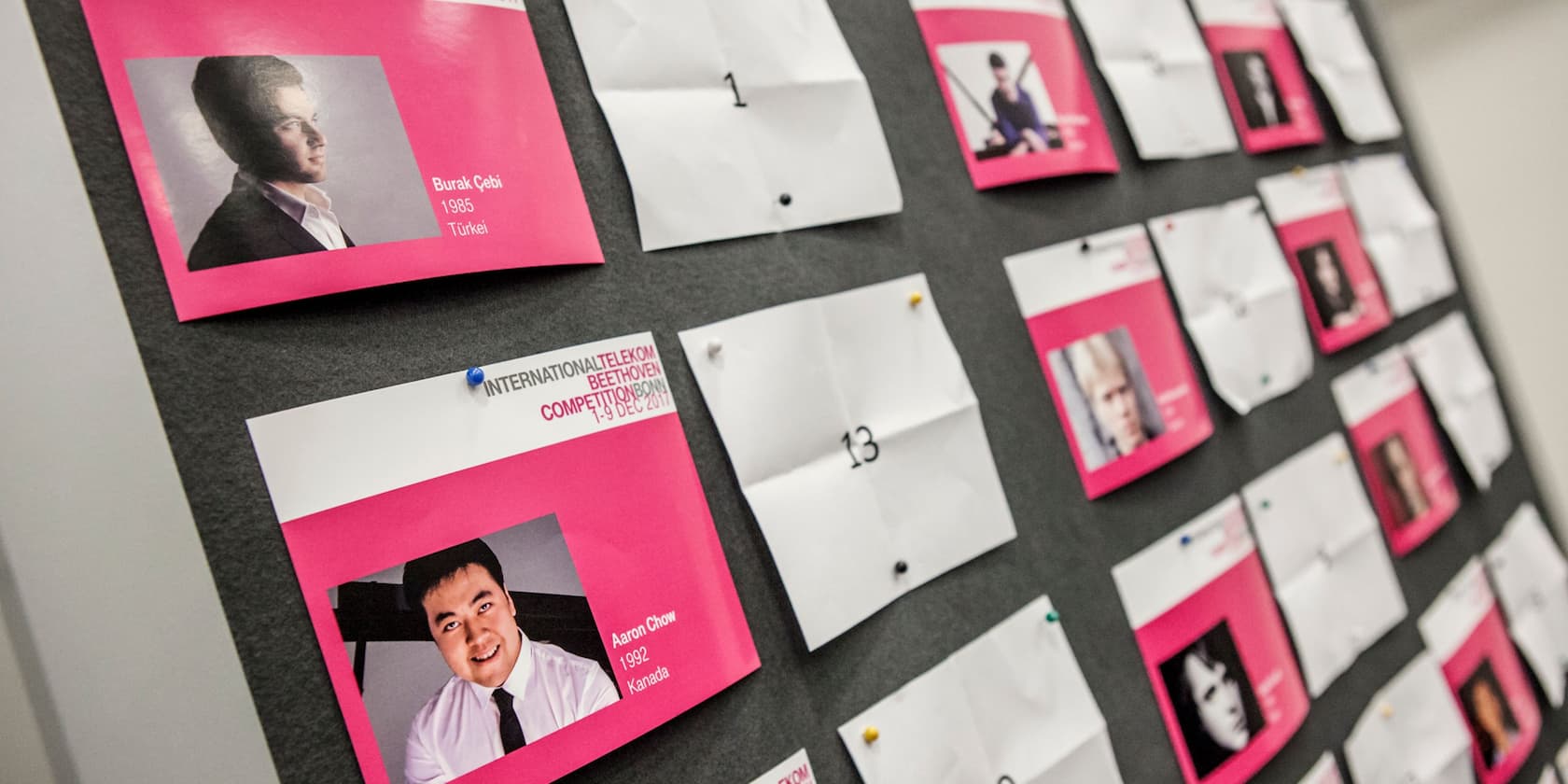 Bulletin board with pictures and names of participants in the International Telekom Beethoven Competition 2017.