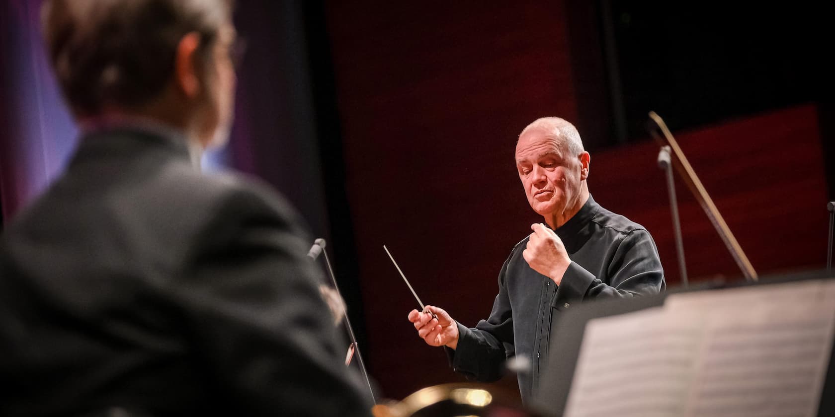 Conductor directing an orchestra during a performance