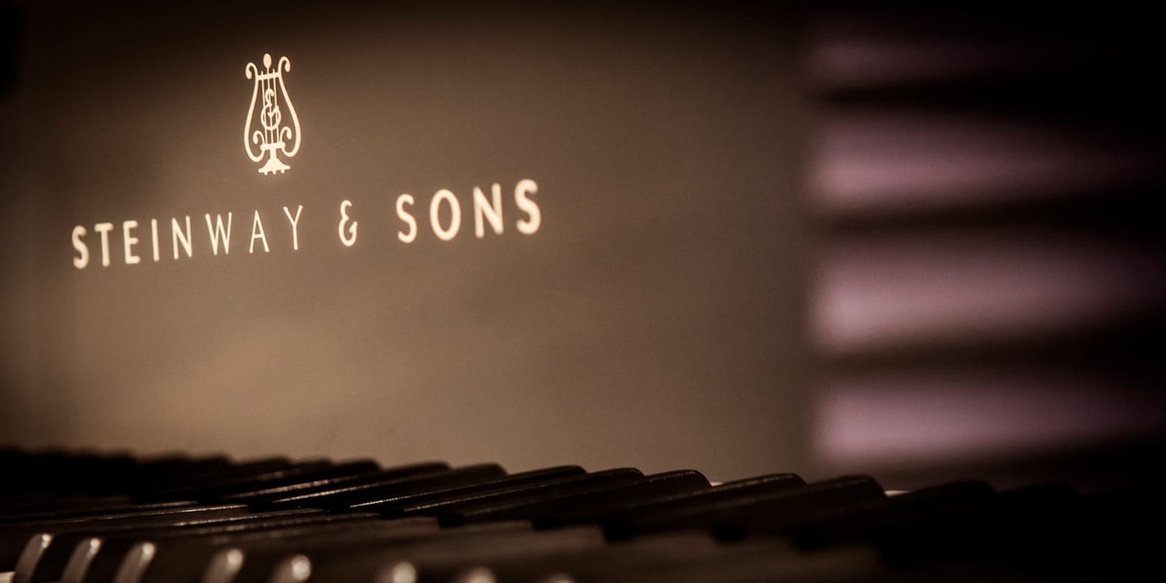 Steinway & Sons logo above piano keys