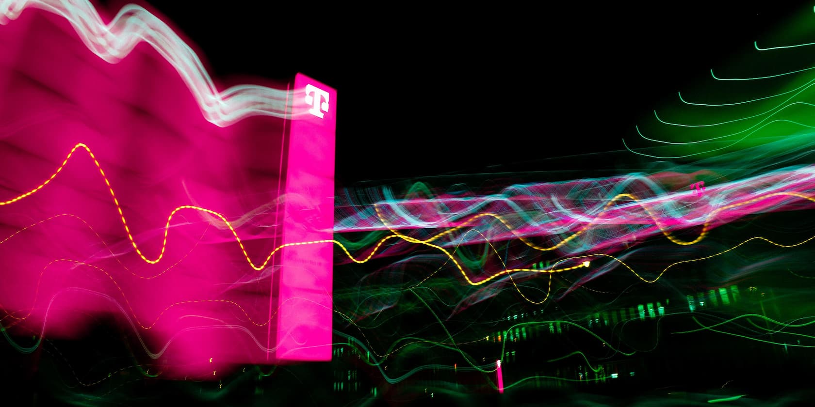 Abstract light painting with wavy lines and a bright pink logo in the background