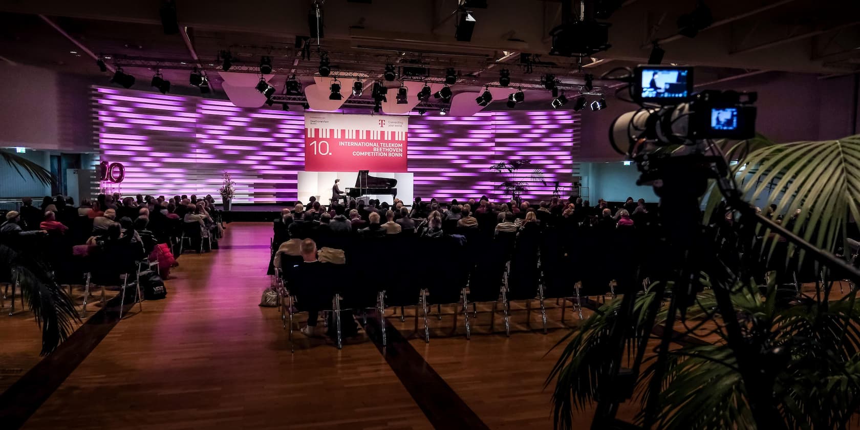 Concert hall with audience and camera recording the 10th International Telekom Beethoven Competition Bonn.