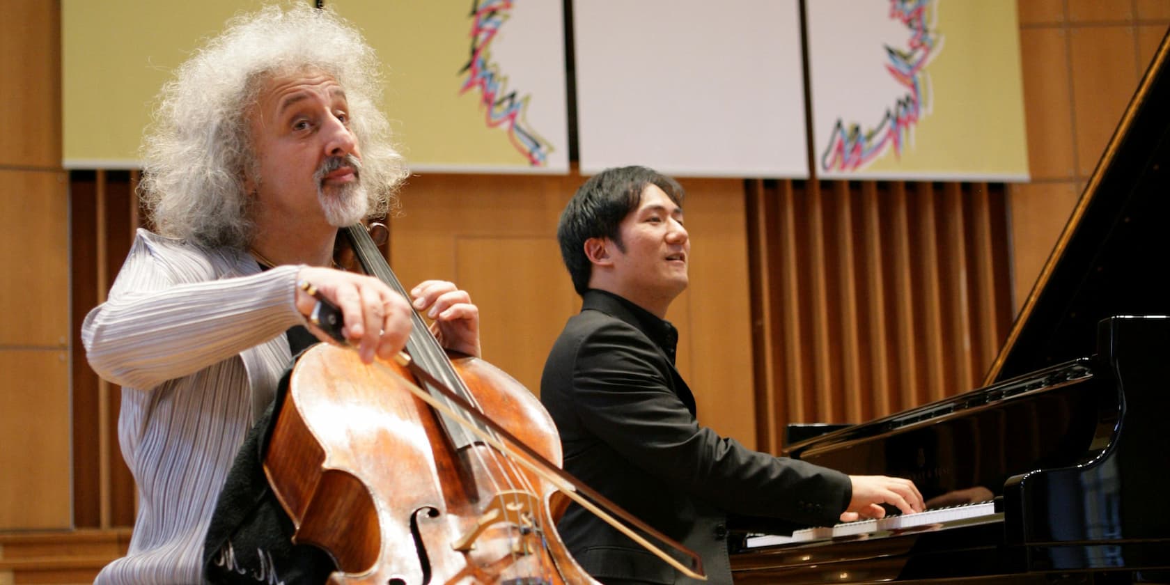 A cellist playing alongside a pianist