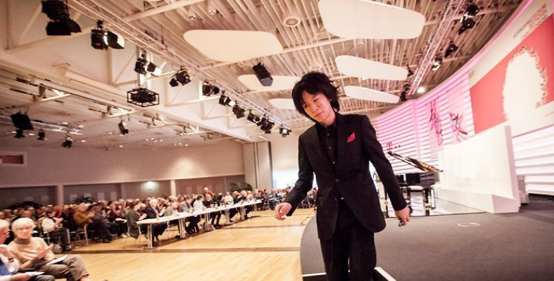 A pianist leaves the stage at a Beethoven competition.